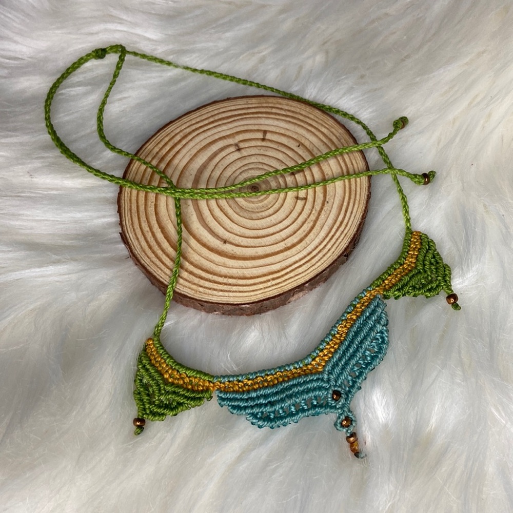 Adjustable waterproof macrame necklace.
